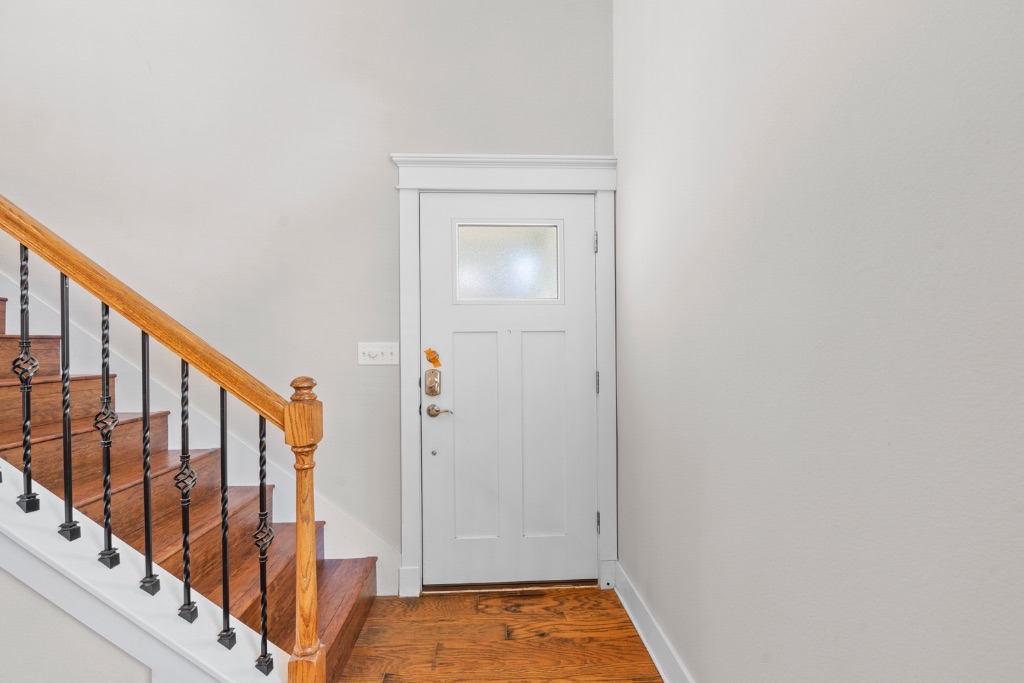 11229 Avery Station Loop, Unit 36 Austin, TX 78717 - Photo 3 of 37 Foyer with stairs and wood finished floors