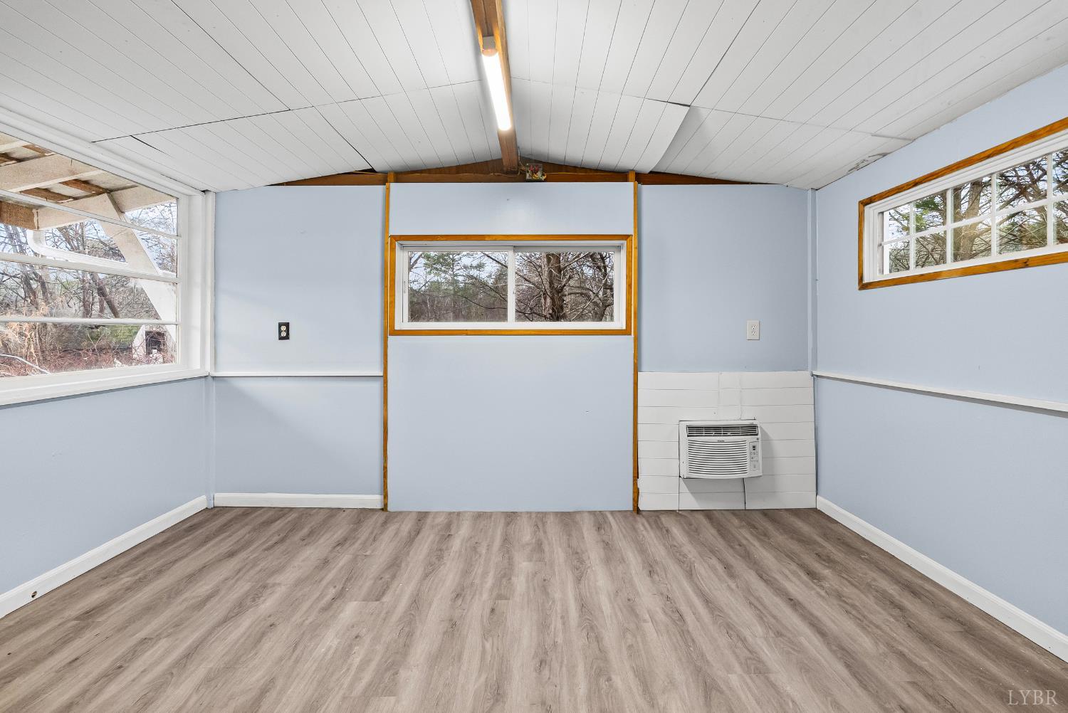 2443 Sunnymeade Road Rustburg, VA 24588 - Photo 12 of 36 a view of a room with wooden floor and a window