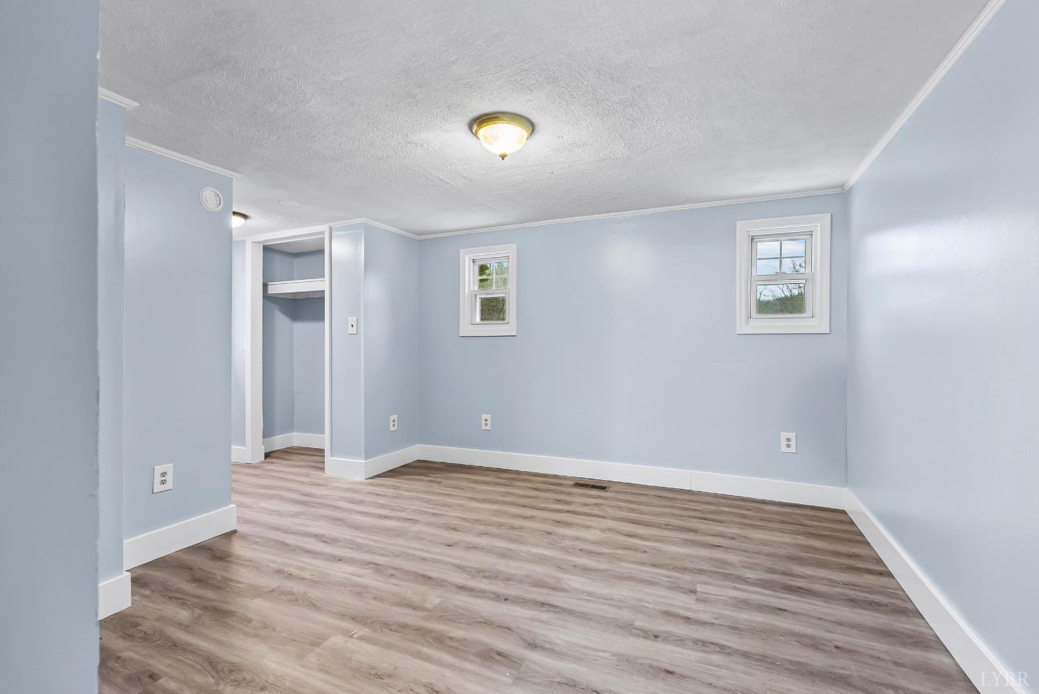 2443 Sunnymeade Road Rustburg, VA 24588 - Photo 14 of 36 a view of an empty room with wooden floor and a window