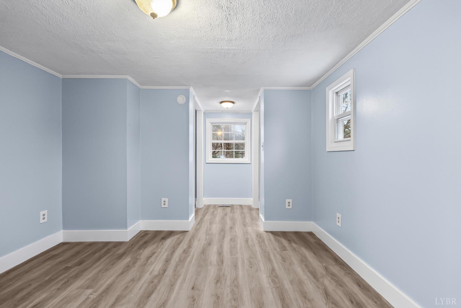 2443 Sunnymeade Road Rustburg, VA 24588 - Photo 15 of 36 wooden floor in an empty room with a window