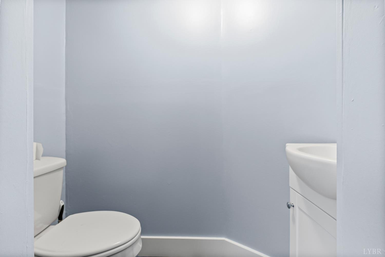 2443 Sunnymeade Road Rustburg, VA 24588 - Photo 24 of 36 a white toilet sitting next to a shower