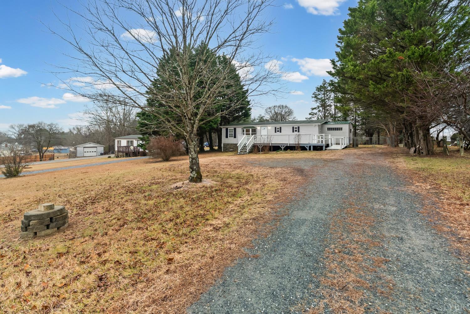 2443 Sunnymeade Road Rustburg, VA 24588 - Photo 27 of 36 a view of a yard with a tree