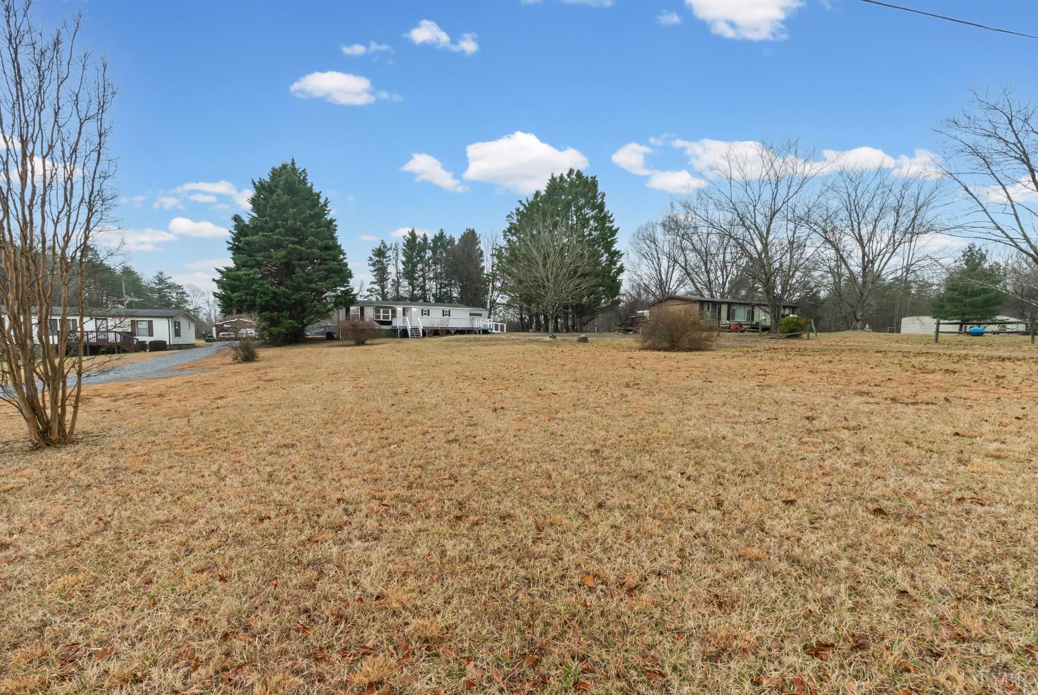2443 Sunnymeade Road Rustburg, VA 24588 - Photo 35 of 36 a view of empty field with trees in the background