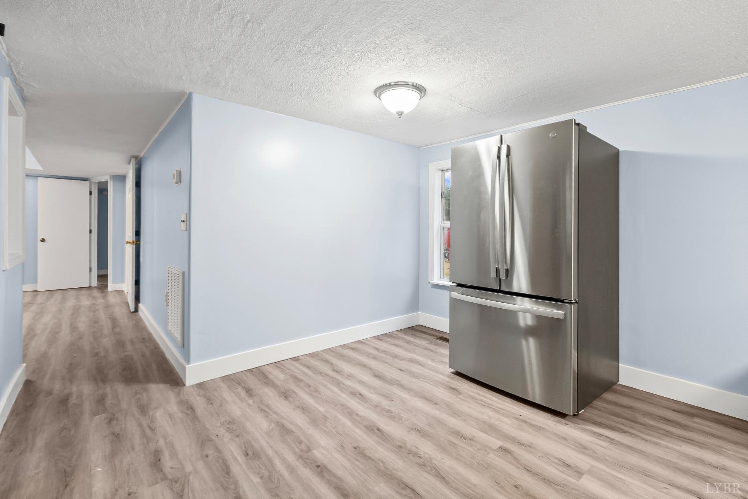2443 Sunnymeade Road Rustburg, VA 24588 - Photo 8 of 36 a view of kitchen with wooden floor electronic appliances and window