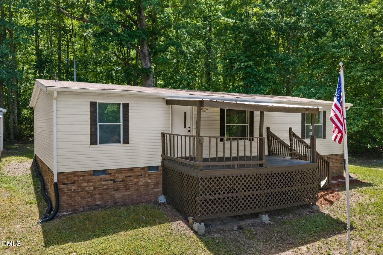 1111 Stoney Mountain Road Rougemont, NC 27572 - Photo 2 of 30 a front view of a house with garden