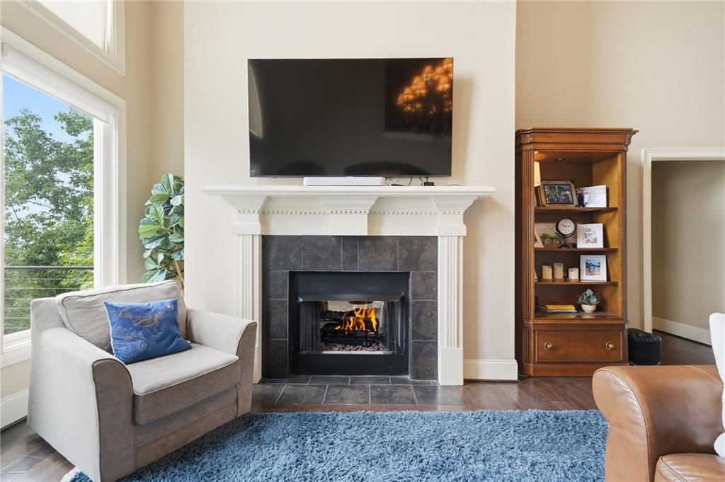 97 Eagle Ridge Trail Cleveland, GA 30528 - Photo 22 of 58 a living room with furniture a flat screen tv and a fireplace