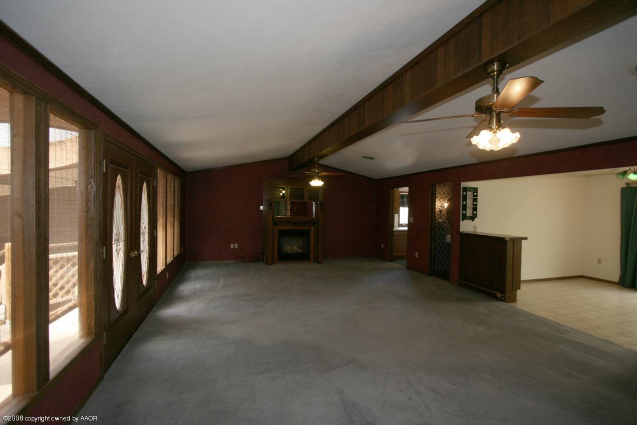 4250 Arden Road Amarillo, TX 79110 - Photo 14 of 22 wooden floor in an empty room with a window