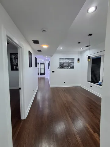 a view of a livingroom with wooden floor