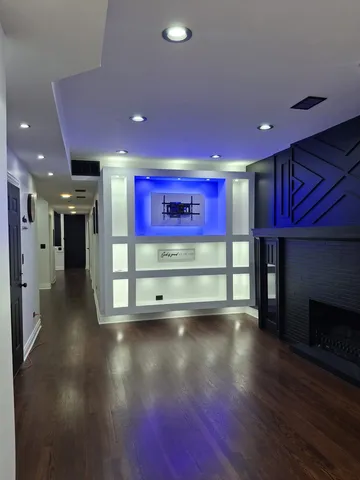 a view of a room with wooden floor