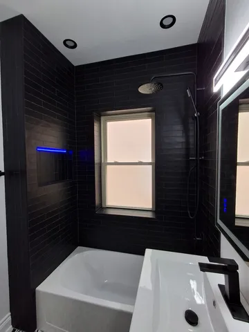 a bathroom with a sink and a bathtub