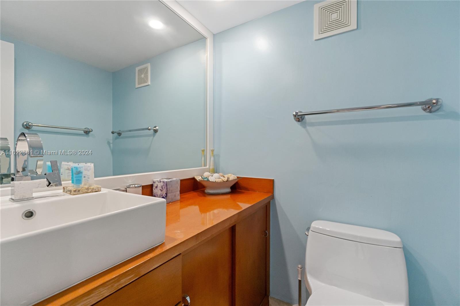 100 Lincoln Road, Unit 1422 Miami Beach, FL 33139 - Photo 19 of 35 a bathroom with a sink and a toilet