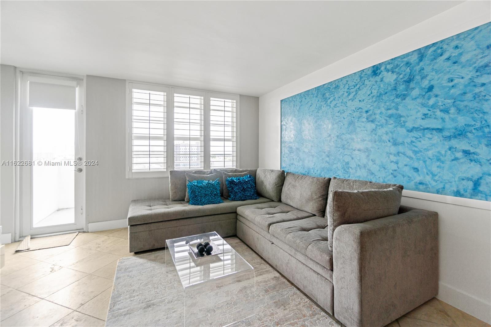 100 Lincoln Road, Unit 1422 Miami Beach, FL 33139 - Photo 2 of 35 a living room with furniture and a window