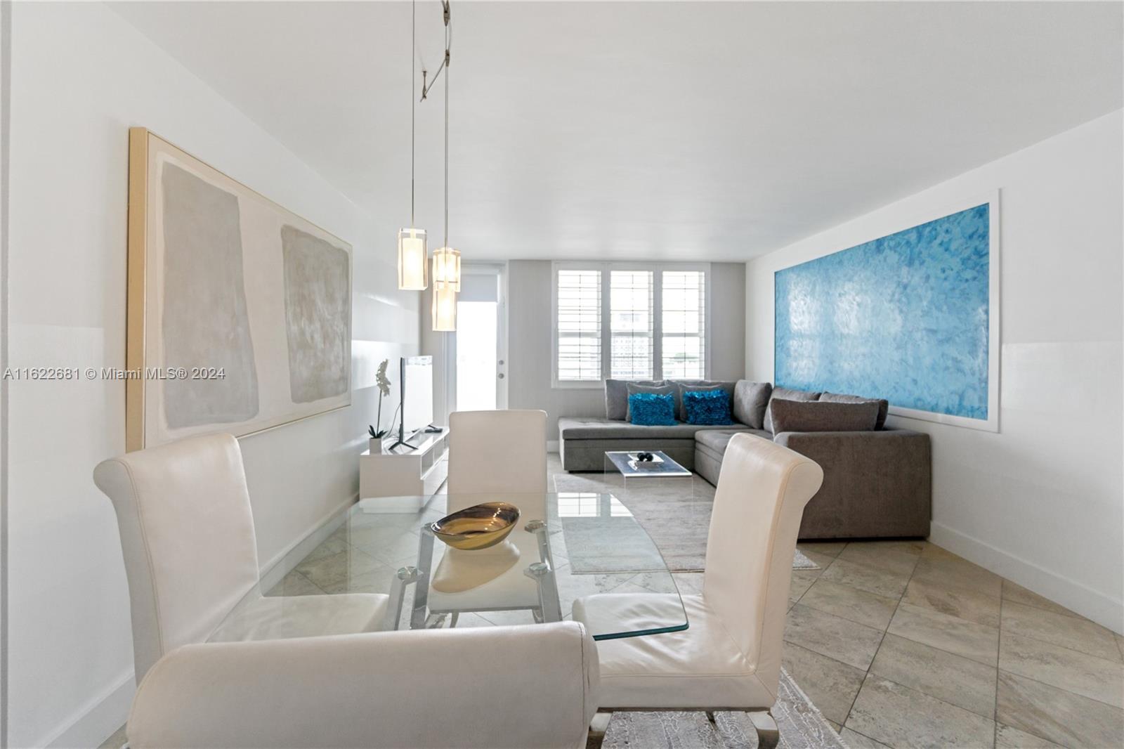 100 Lincoln Road, Unit 1422 Miami Beach, FL 33139 - Photo 5 of 35 a living room with furniture and a window
