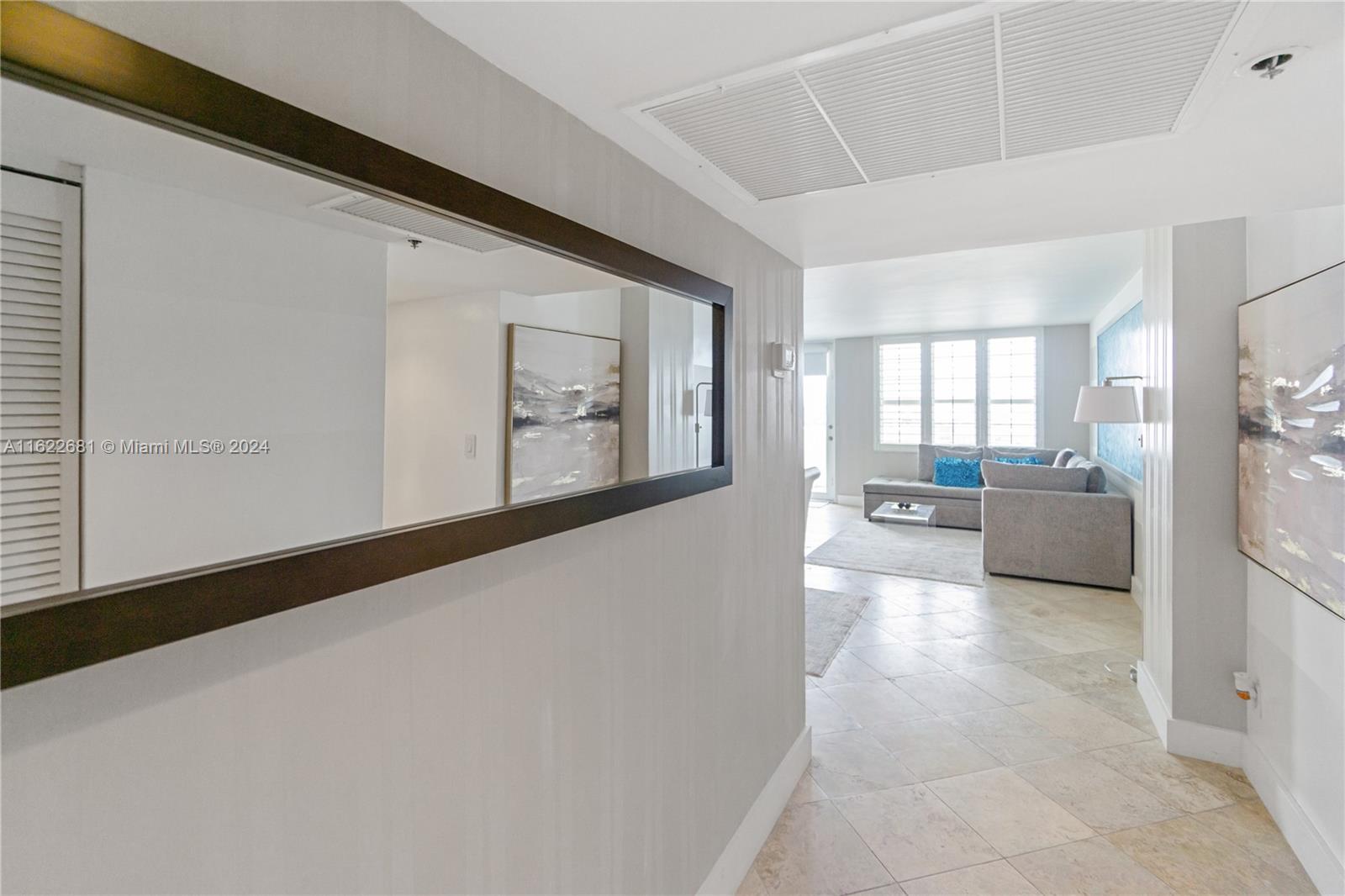 100 Lincoln Road, Unit 1422 Miami Beach, FL 33139 - Photo 10 of 35 a view of a hallway with a living room