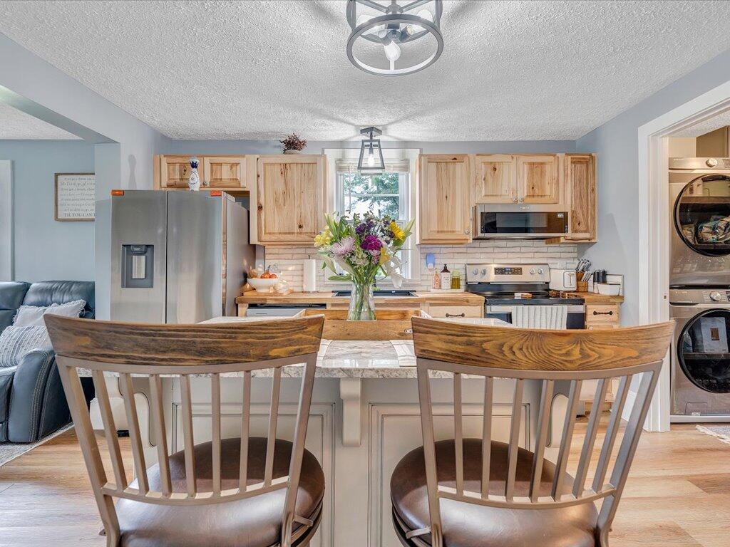 214 Spring Road Patrick Springs, VA 24133 - Photo 16 of 49 a view of a kitchen with furniture and a ceiling fan