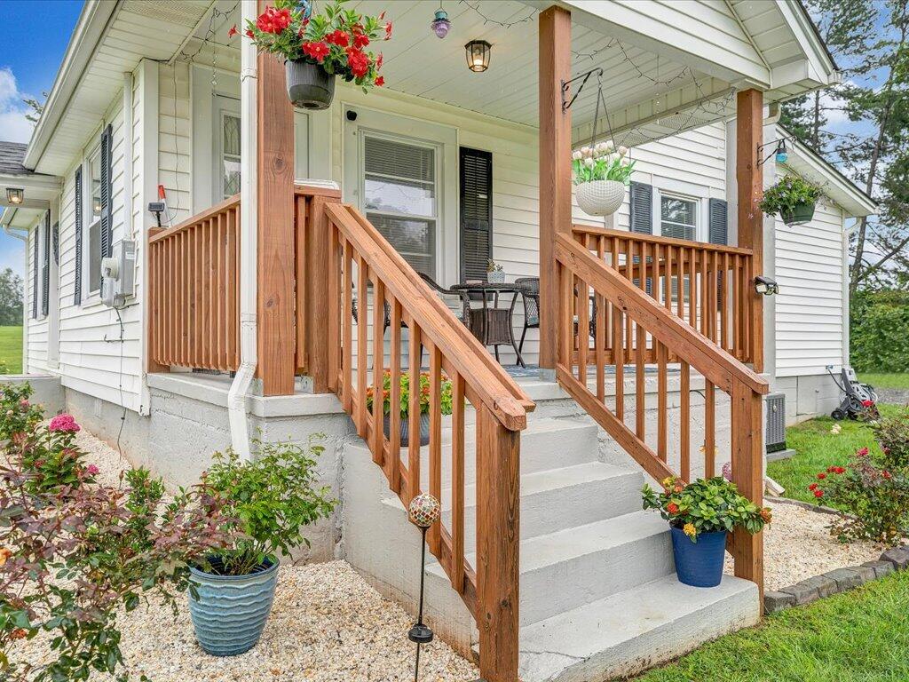 214 Spring Road Patrick Springs, VA 24133 - Photo 22 of 49 a view of a potted plants on a balcony