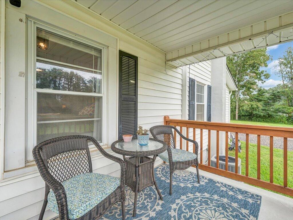214 Spring Road Patrick Springs, VA 24133 - Photo 23 of 49 a view of a two chairs in the balcony