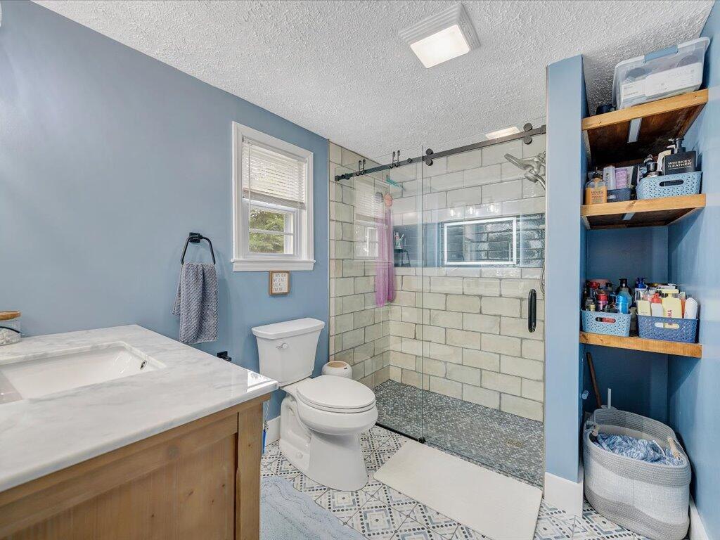 214 Spring Road Patrick Springs, VA 24133 - Photo 24 of 49 a bathroom with a sink toilet and shower