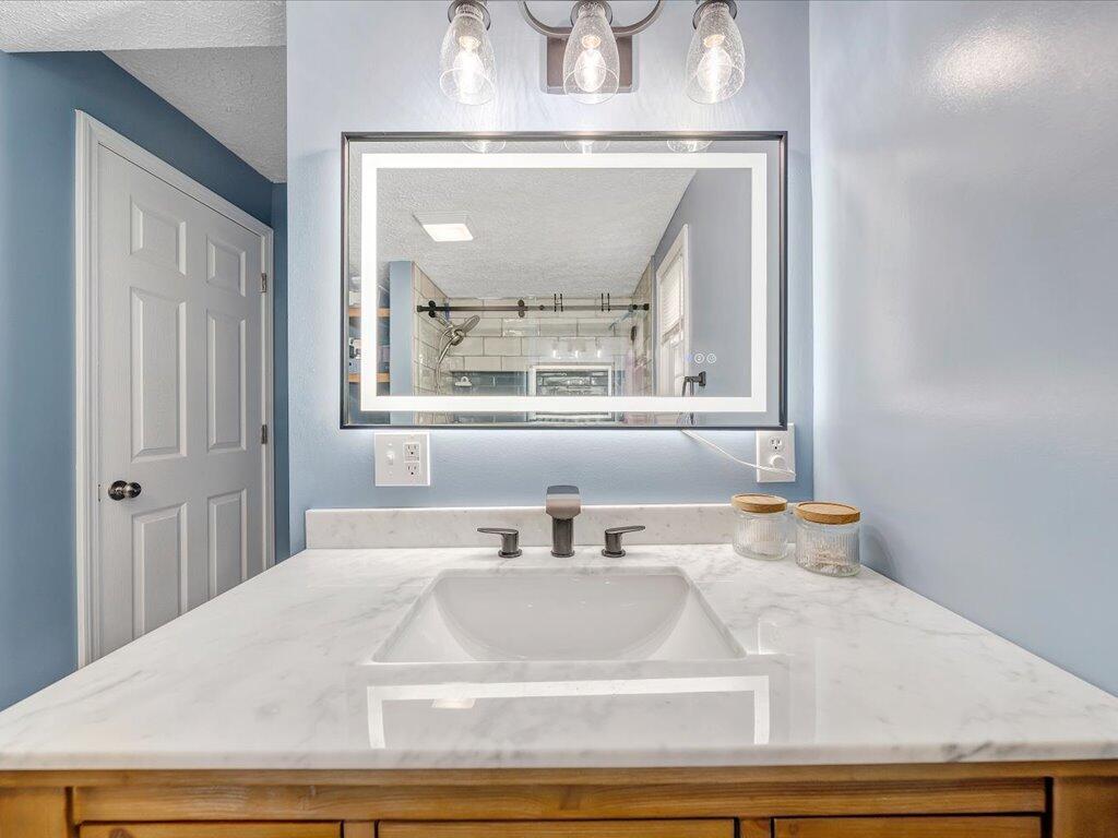 214 Spring Road Patrick Springs, VA 24133 - Photo 27 of 49 a bathroom with a sink and a mirror
