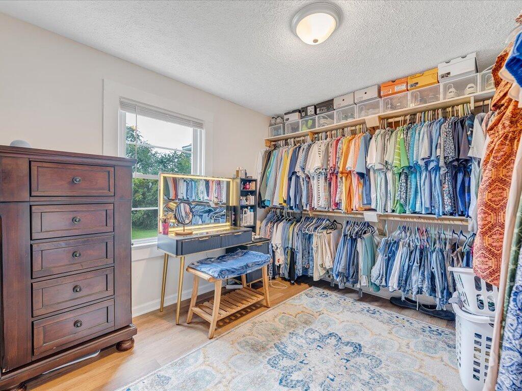 214 Spring Road Patrick Springs, VA 24133 - Photo 28 of 49 a view of walk in closet with clothes and shoes