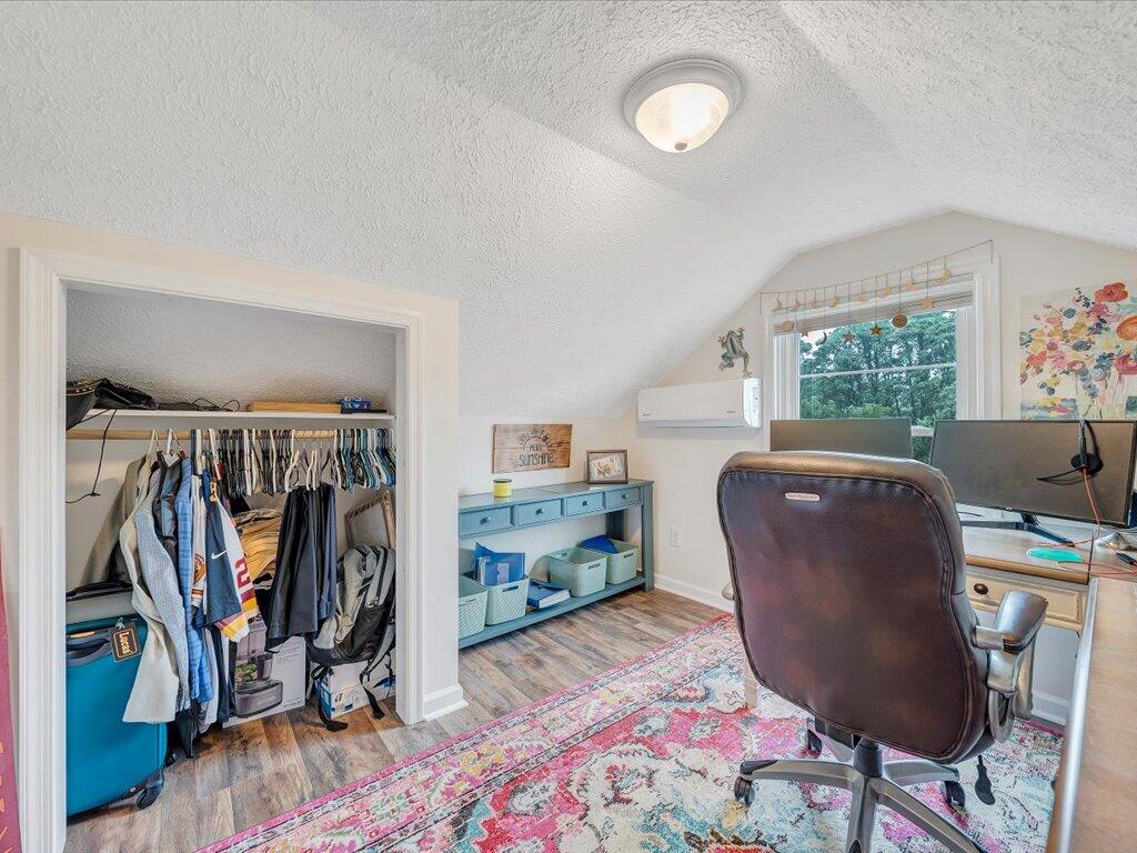 214 Spring Road Patrick Springs, VA 24133 - Photo 33 of 49 a view of a workspace with furniture and a window