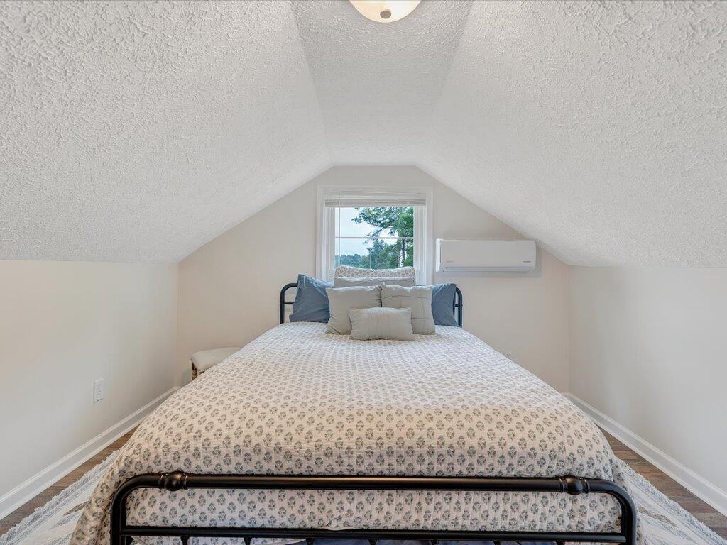 214 Spring Road Patrick Springs, VA 24133 - Photo 34 of 49 a bedroom with a large bed and a window