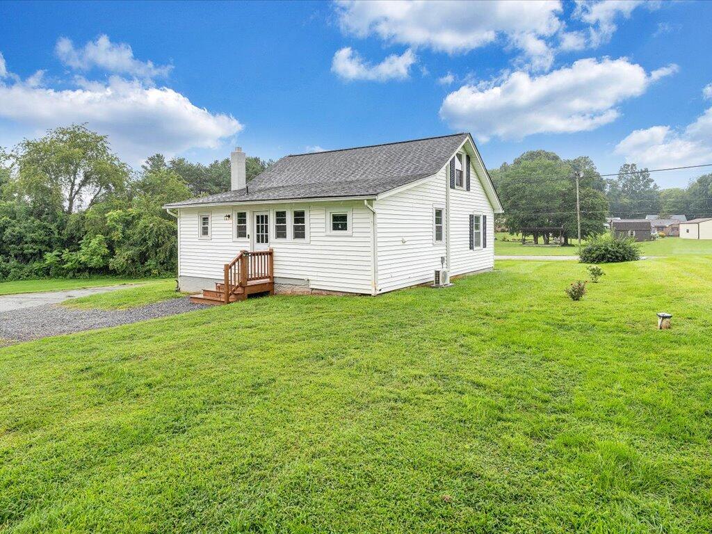 214 Spring Road Patrick Springs, VA 24133 - Photo 39 of 49 a view of a house with a yard porch and sitting area
