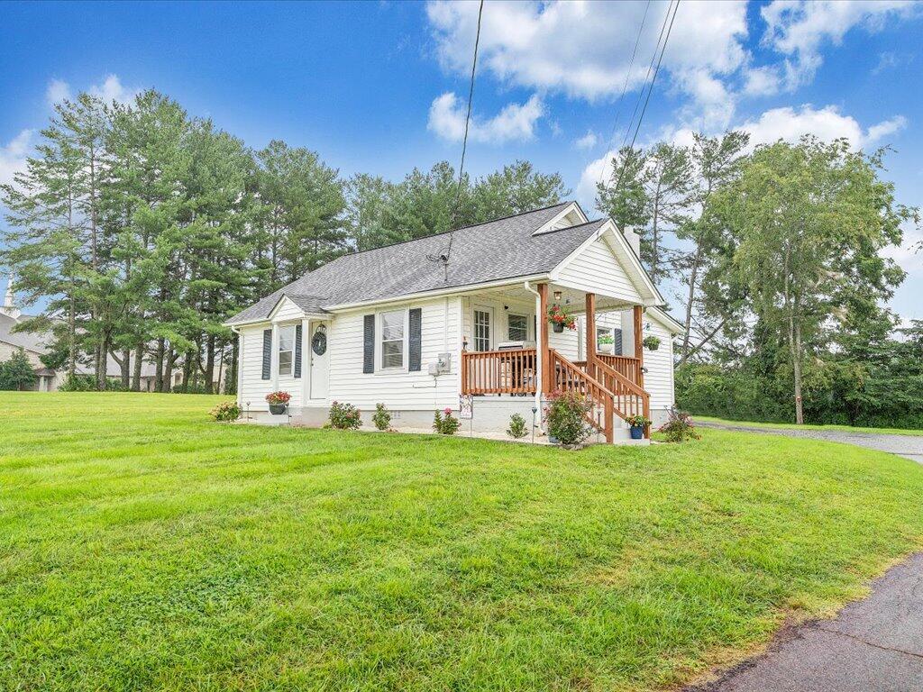 214 Spring Road Patrick Springs, VA 24133 - Photo 44 of 49 a view of a house with a yard