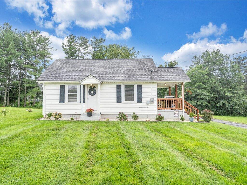 214 Spring Road Patrick Springs, VA 24133 - Photo 46 of 49 a front view of a house with a yard