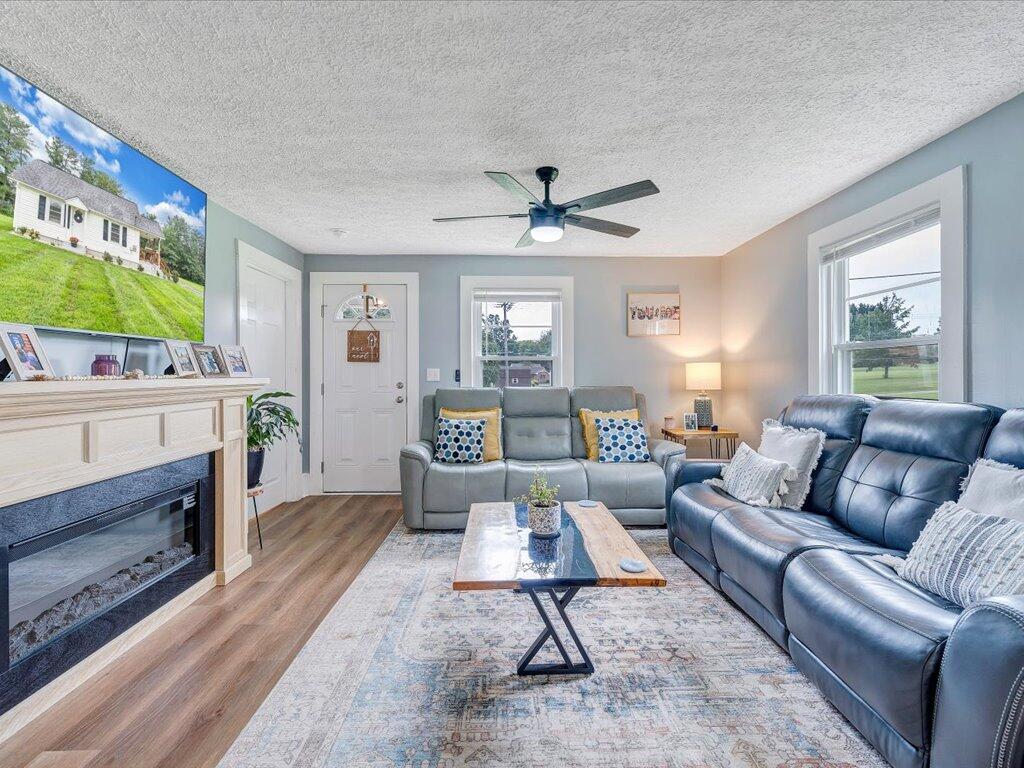214 Spring Road Patrick Springs, VA 24133 - Photo 6 of 49 a living room with furniture and a large window