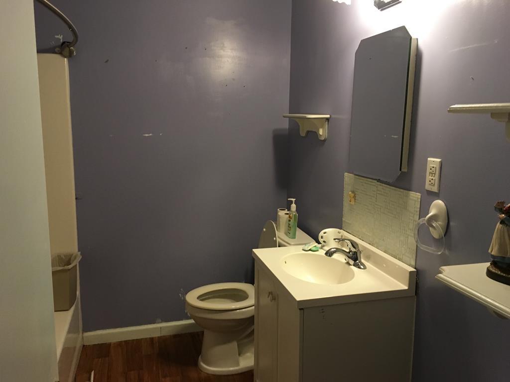 1064 Lee King Road Forsyth, GA 31029 - Photo 12 of 25 a bathroom with a sink toilet and a mirror