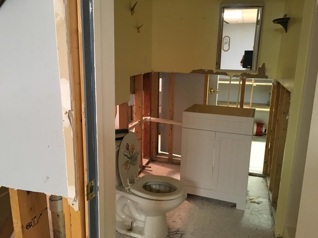1064 Lee King Road Forsyth, GA 31029 - Photo 24 of 25 a bathroom with a toilet and a mirror