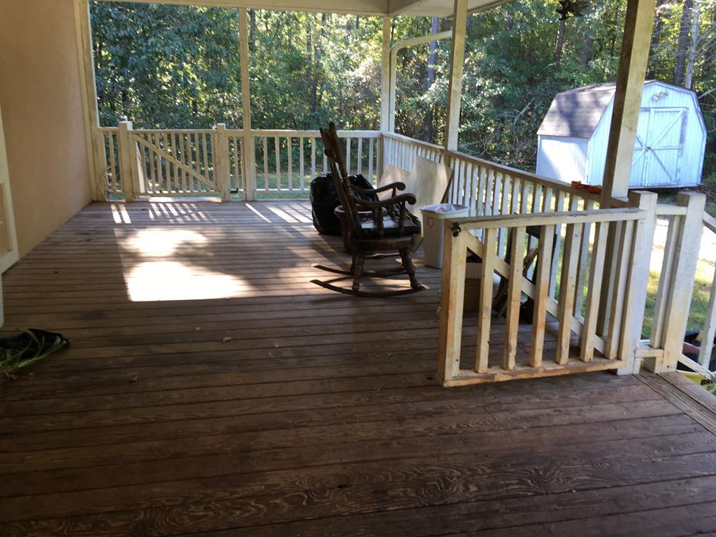 1064 Lee King Road Forsyth, GA 31029 - Photo 4 of 25 a view of a deck with wooden floor and fence