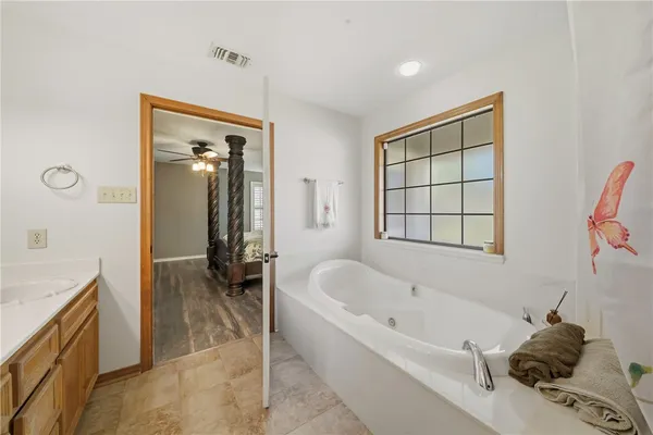 a bathroom with a bathtub and a sink