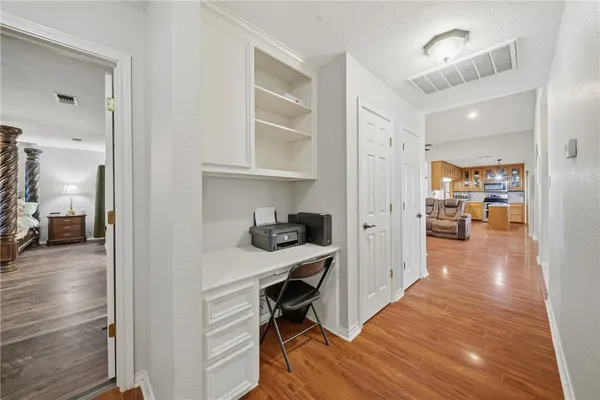 a view of a kitchen from the hallway