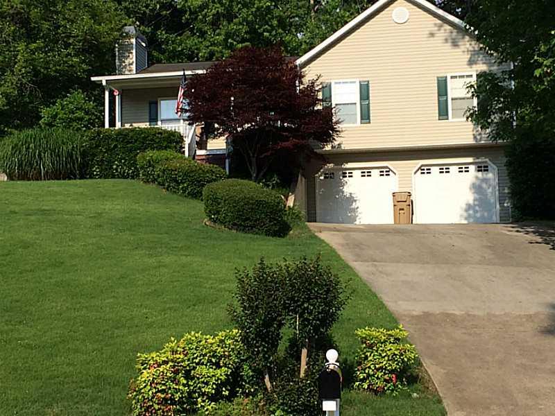 313 Split Rail Way Canton, GA 30115 - Photo 1 of 1 Exterior Front. Well-maintained landscape with irrigation system.