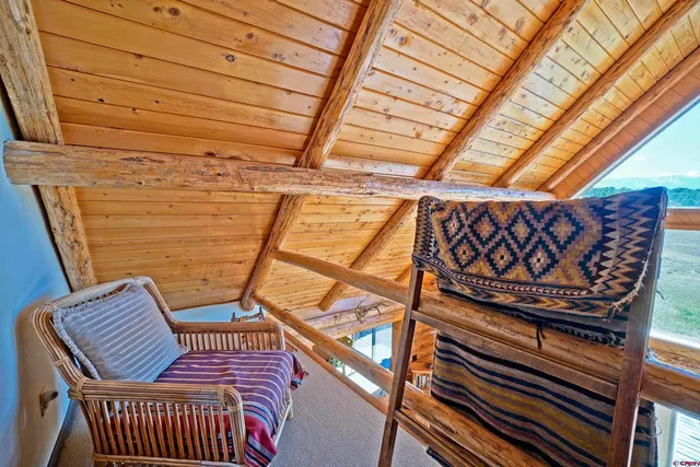 a view of a balcony with furniture