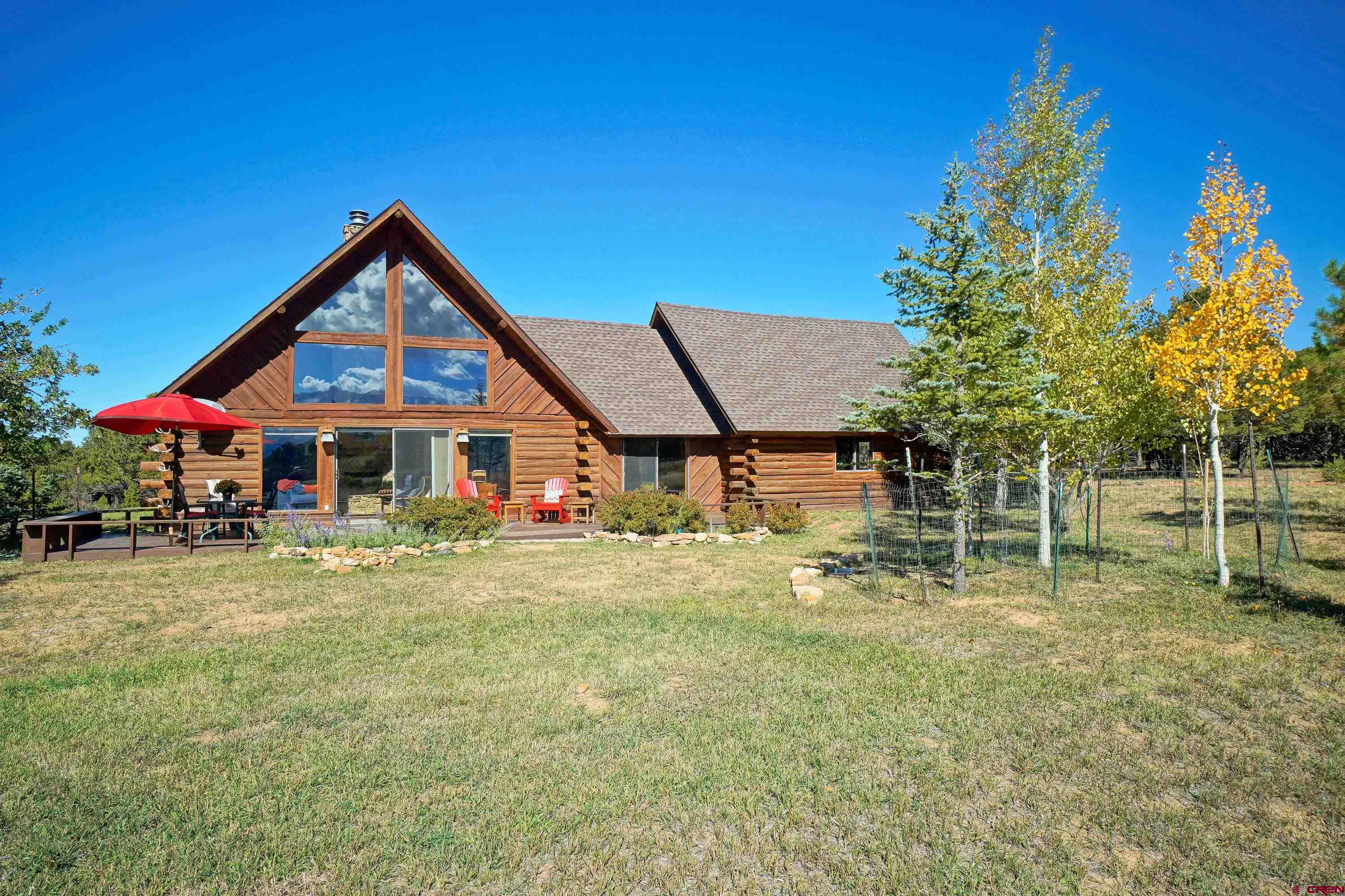 76 Tower Road South Ridgway, CO 81432 - Photo 26 of 37 a front view of a house with a yard