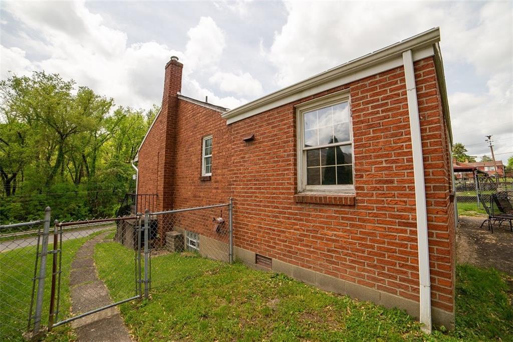 443 Streets Run Road Pittsburgh, PA 15236 - Photo 22 of 25 Side door from kitchen and sidewalk that leads to fenced in back yard.