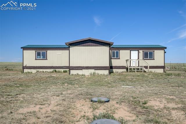 5274 South Yoder Road Yoder, CO 80864 - Photo 16 of 42 SEPTIC TANK LIDS AND FRONT OF 5274 HOME