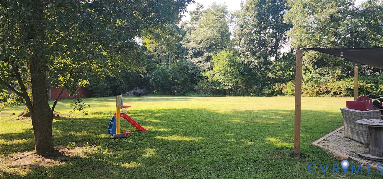 3170 Ella Road Henrico, VA 23231 - Photo 13 of 50 Expansive lawn with mature trees and a shaded pati