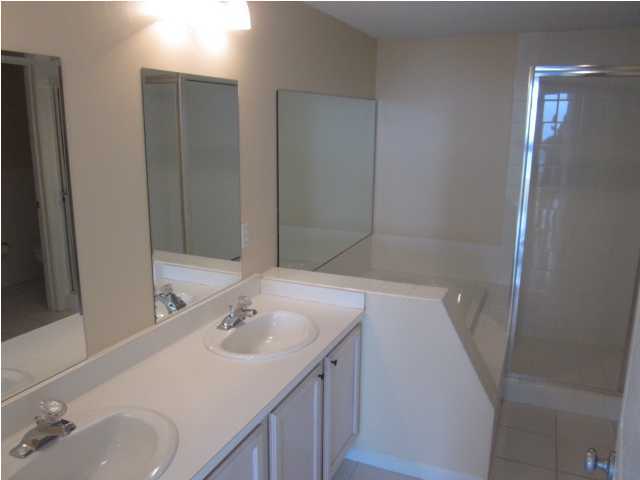 8600 East County Highway 30A, Unit 140 Seacrest, FL 32461 - Photo 11 of 16 a bathroom with a sink and a mirror
