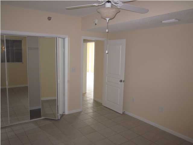 8600 East County Highway 30A, Unit 140 Seacrest, FL 32461 - Photo 12 of 16 wooden floor in an empty room