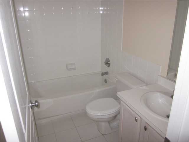 8600 East County Highway 30A, Unit 140 Seacrest, FL 32461 - Photo 13 of 16 a white toilet sitting next to a bath tub