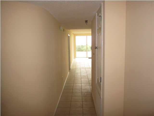 8600 East County Highway 30A, Unit 140 Seacrest, FL 32461 - Photo 14 of 16 a view of hallway with wooden floor