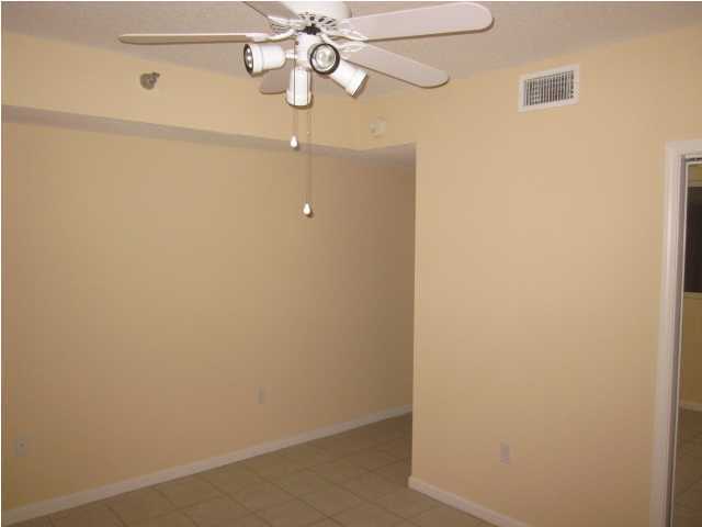 8600 East County Highway 30A, Unit 140 Seacrest, FL 32461 - Photo 15 of 16 a view of a chandelier fan and wooden floor