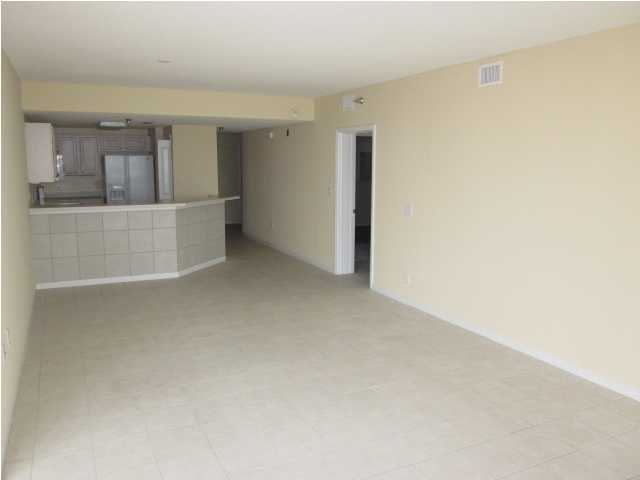 8600 East County Highway 30A, Unit 140 Seacrest, FL 32461 - Photo 9 of 16 a view of a kitchen with white cabinets