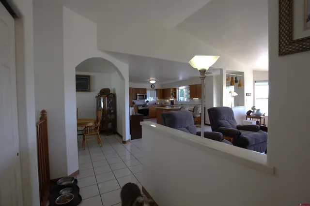 a lobby with furniture and a mirror