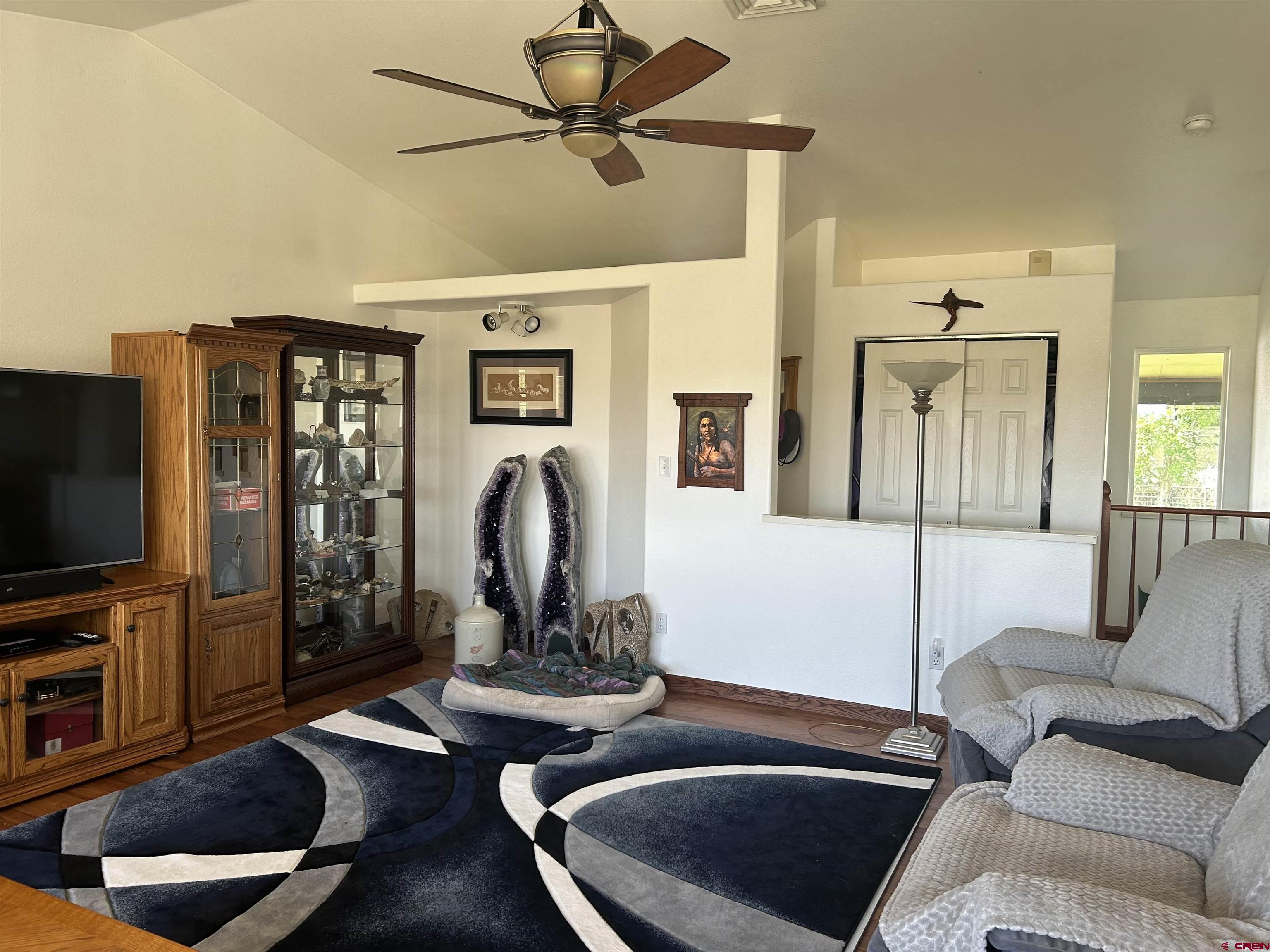 29669 DD Road Nucla, CO 81424 - Photo 18 of 33 a living room with furniture and a flat screen tv