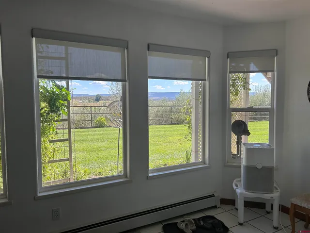 a view of chair and table in a room